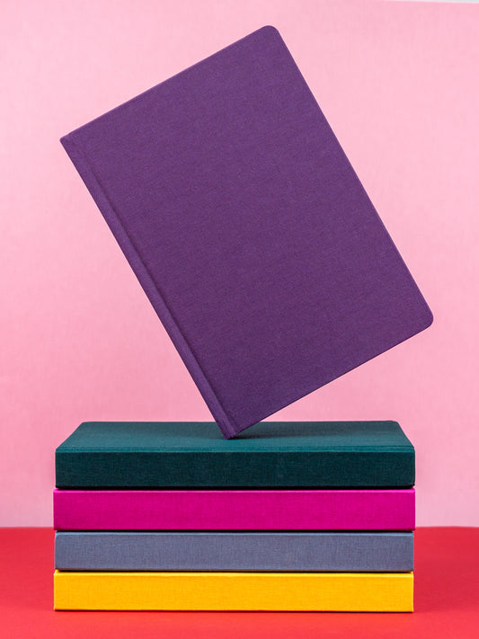 A stack of colorful planners