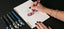 caran dache pen on a desk