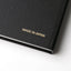 Black book with 'MADE IN JAPAN' text on a white background