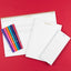 Notebooks with colorful pens on a red background