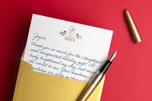 Hand written thank you note on a red background