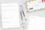 A collection of tools to help you achieve goals: a notepad, pens, planner, and small book.