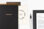 An array of white, grey, and gold office gifts for administrative professionals day.