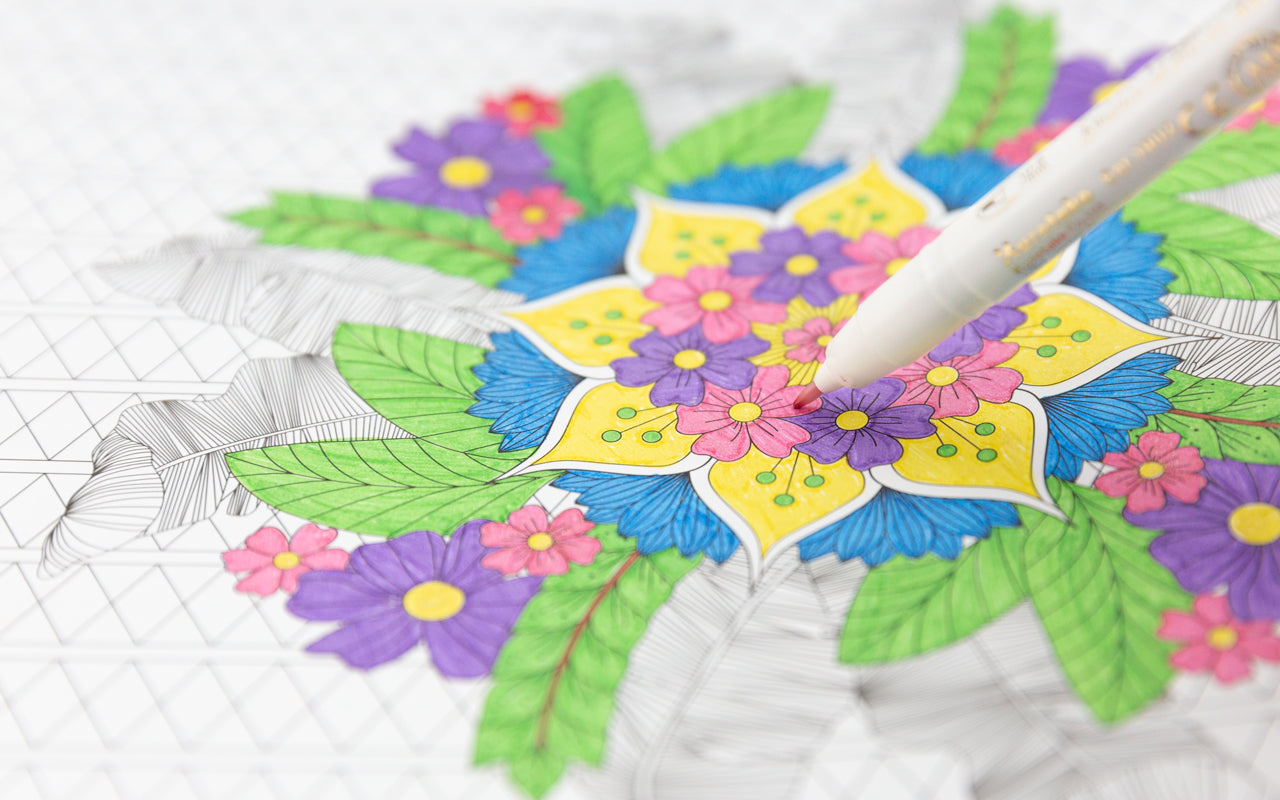 A brightly colored coloring page of flowers with a colored pen marker.