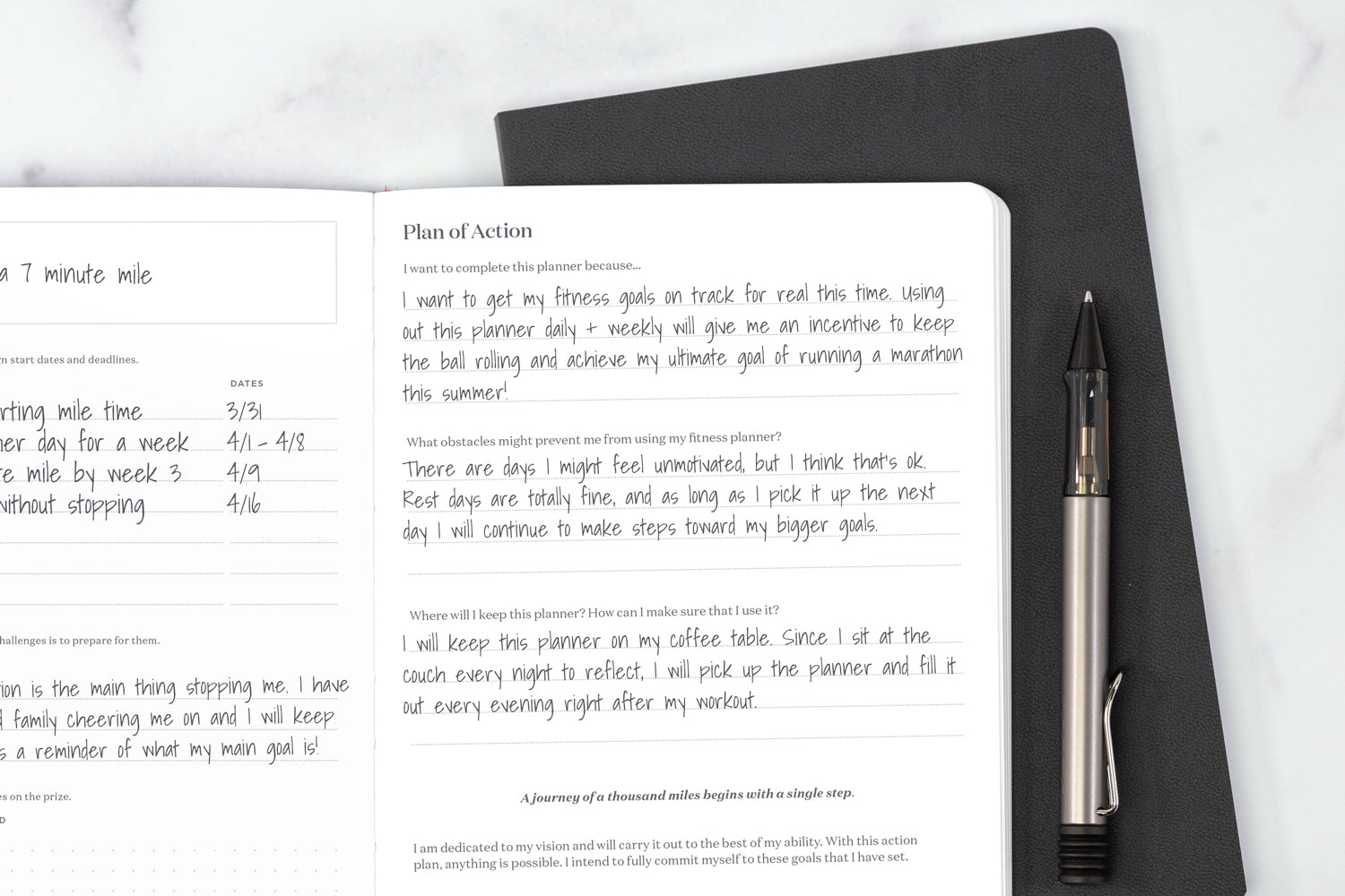 a fitness journal with smart fitness goals written in it, lying on top of another journal on a white table