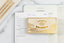An array of white and gold Ink+Volt mindfulness gifts