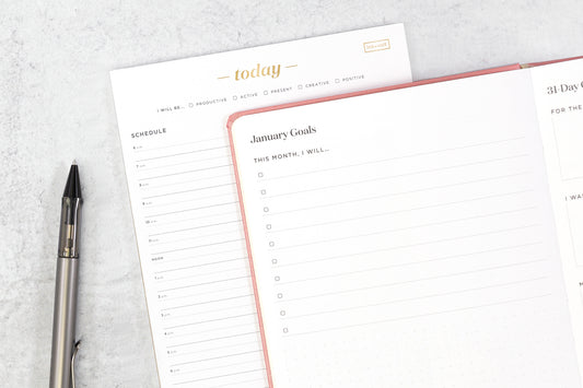 Career path tools: a today planning pad and a planner open to a page for January goals.