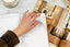 A hand turns the page of a 2024 planner
