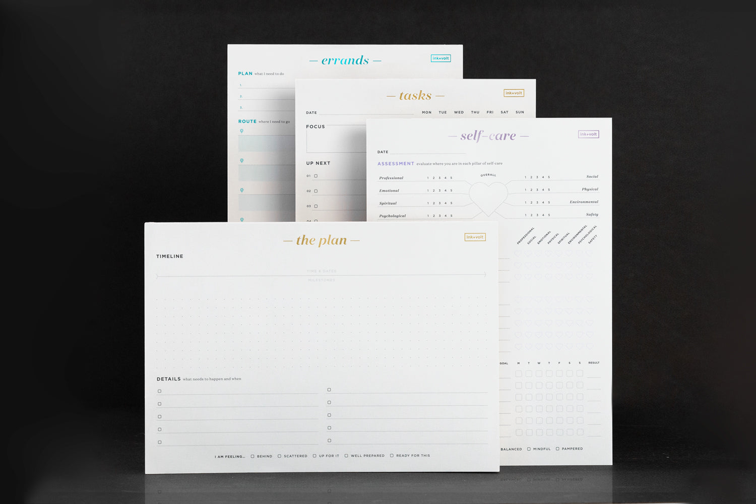 A stack of white stationery notepads on a black background.