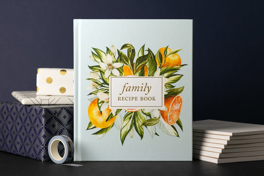 Family recipe book surrounded by wrapped gifts