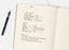 A large notebook with a breakdown of costs and questions to ask to get organized
