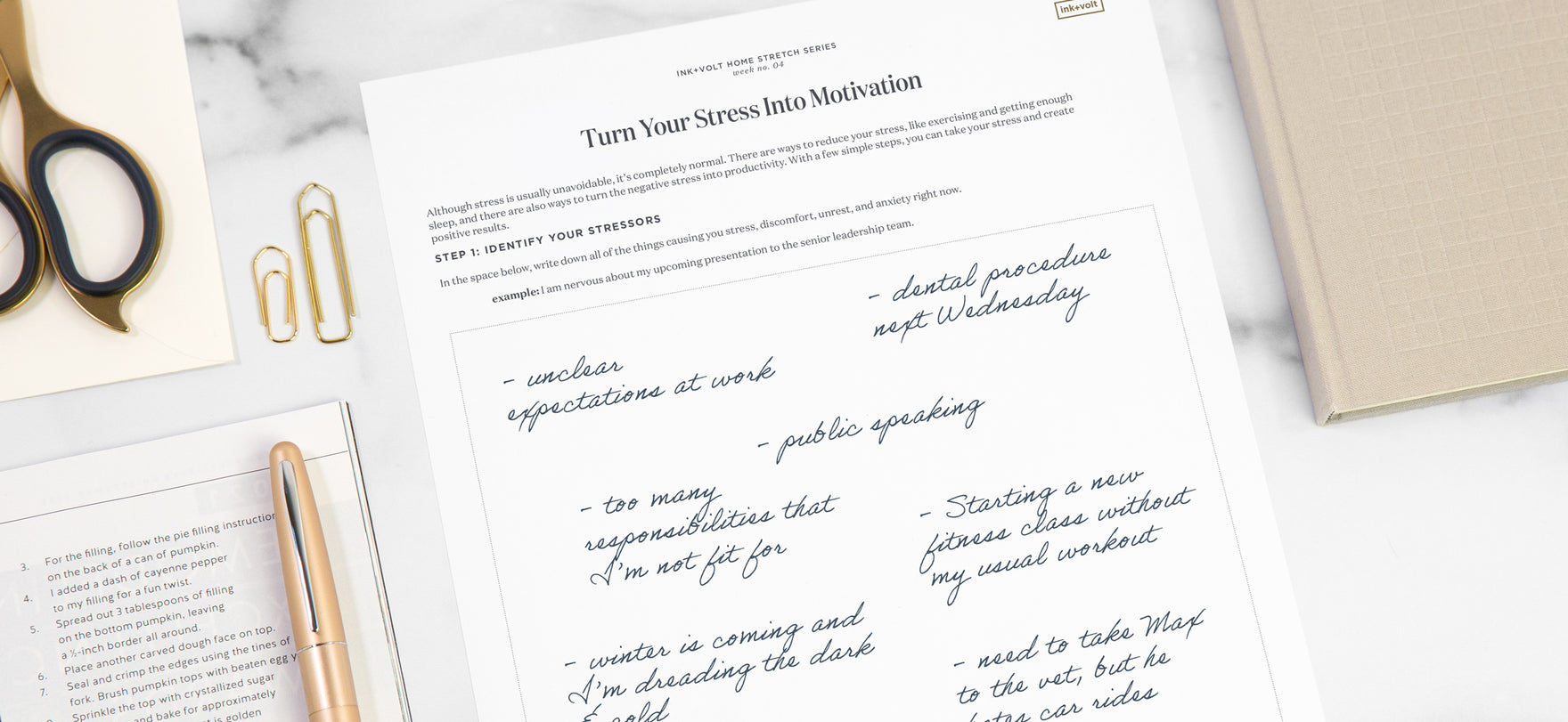 A worksheet titled "turn your stress into motivation" on a desk with accessories