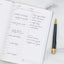 An hourly planner with time slots filled in with a busy schedule