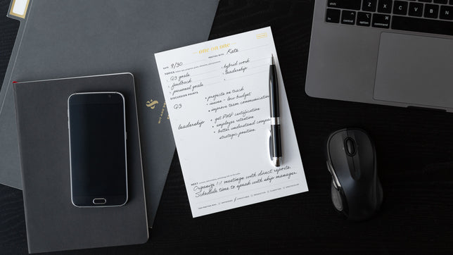 4 ink and volt productivity notepads on a desk