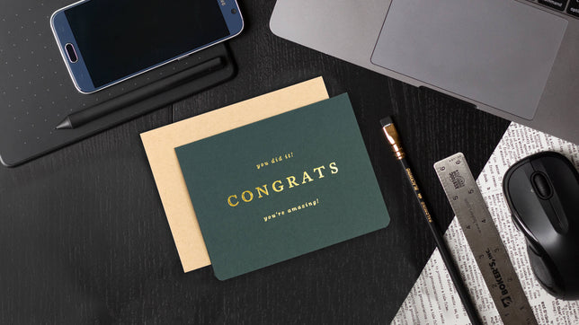 congratulations card on a desk
