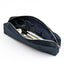 Navy blue pouch with scissors and other items on a white background