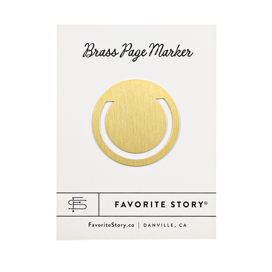 circle brass page marker attached to packaging