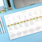Colorful planner sheet with checkboxes on a blue surface with stationery items.