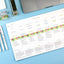 Colorful planner sheet with checkboxes on a blue surface with stationery items.