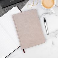 Ink and Volt Taupe Notebook on a marble desk