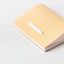 Notebook with yellow geometric pattern on a white background
