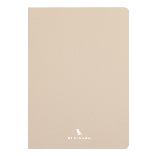 Beige notebook with a brand logo on a black background