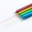 Four colorful markers (red, yellow, green, blue) on lined paper with lines drawn by each marker.